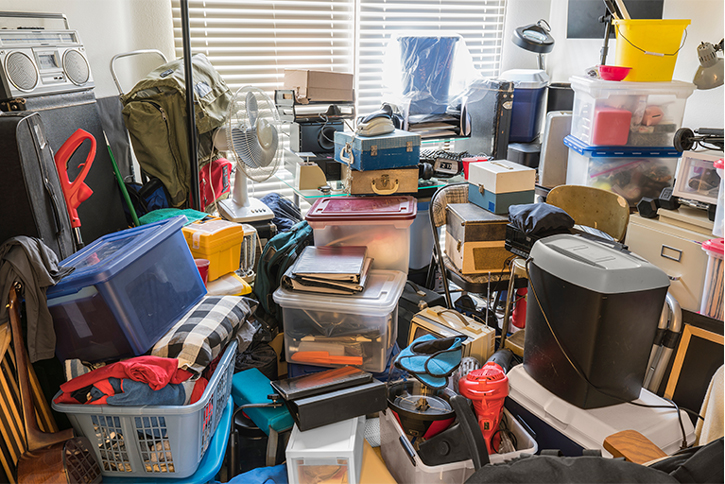 room packed with boxes, electronics, business equipment, household objects and miscellaneous items