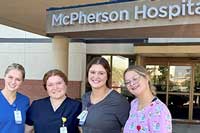 McPherson interns in front of hospital