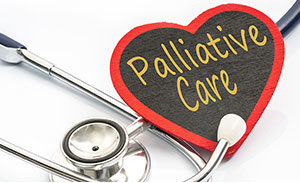 palliative care text written on a heart, with stethoscope