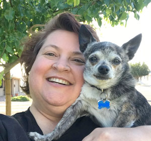 Gloriana Hunter poses with her dog Pepe Ricardo