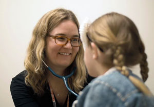 Dr. Bird Gilmartin with a patient