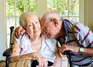 older adult couple, seated close together