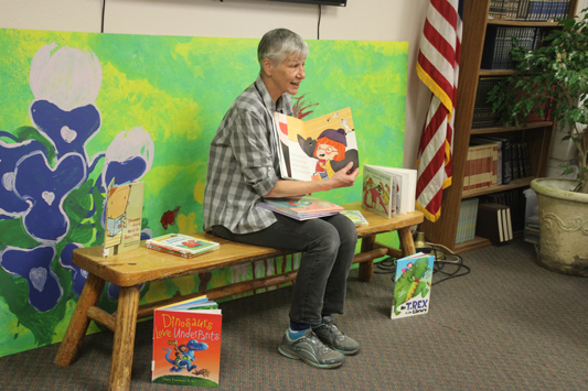 Judy Bergeron reads a book during storytime.